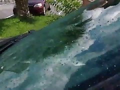 Girl in swimsuit at the car wash