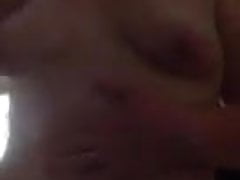 Amateur girl oils her tits