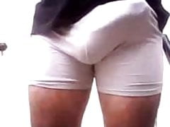 White bulging shorts and tight white gloves