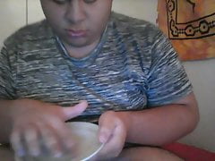 Fat boy cums on plate than licks it off