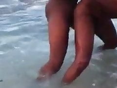 Two black men having sex in the sea