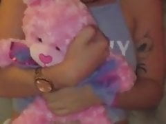 Shy baby girl holds her teddybear
