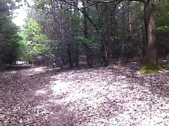 walking in the woods almaost naked with fake boobs