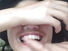 Cumshot on sweet asian girl face