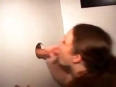 Amateur Girl Taking Facial Cumshot Through Glory Hole