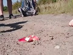 Young gay crushes apple in the dust while hiking